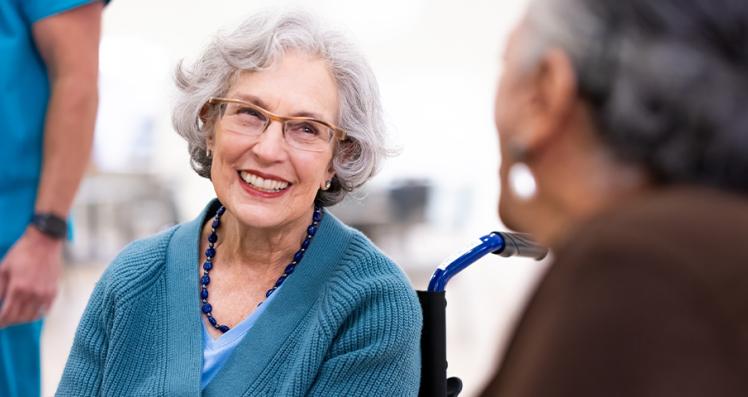 Elder Woman Smiling to Another Woman