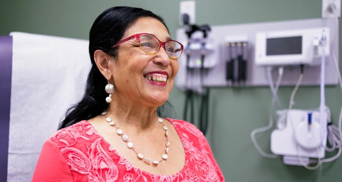 Woman Smiling with New Glasses On